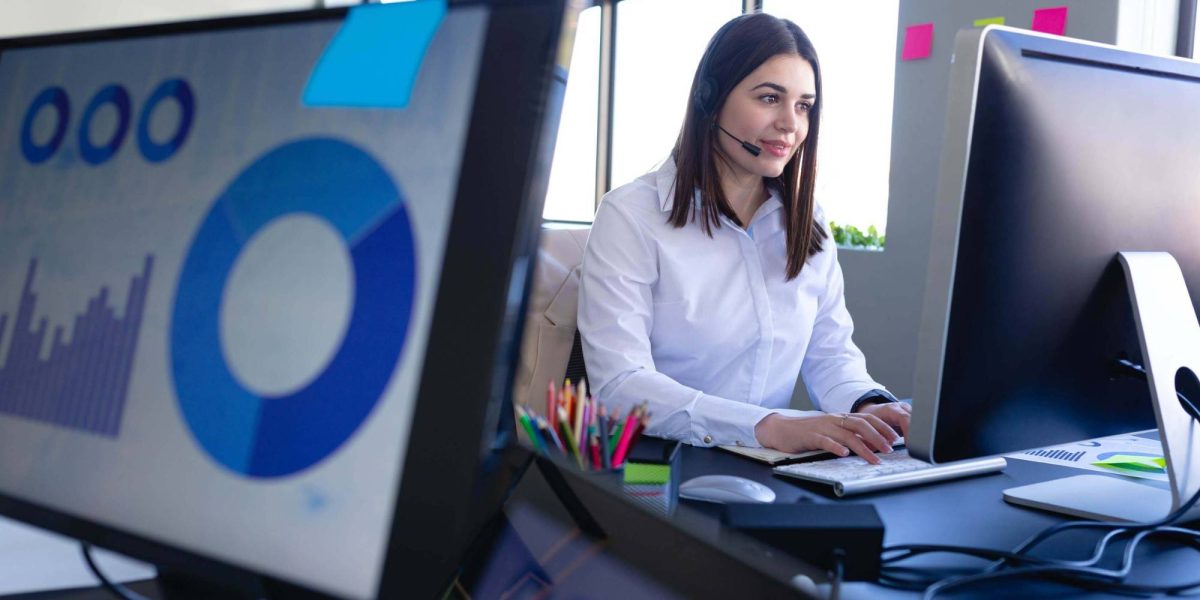 caucasian-woman-working-with-headphone-set-and-sta-T9UH6JQ-1.jpg